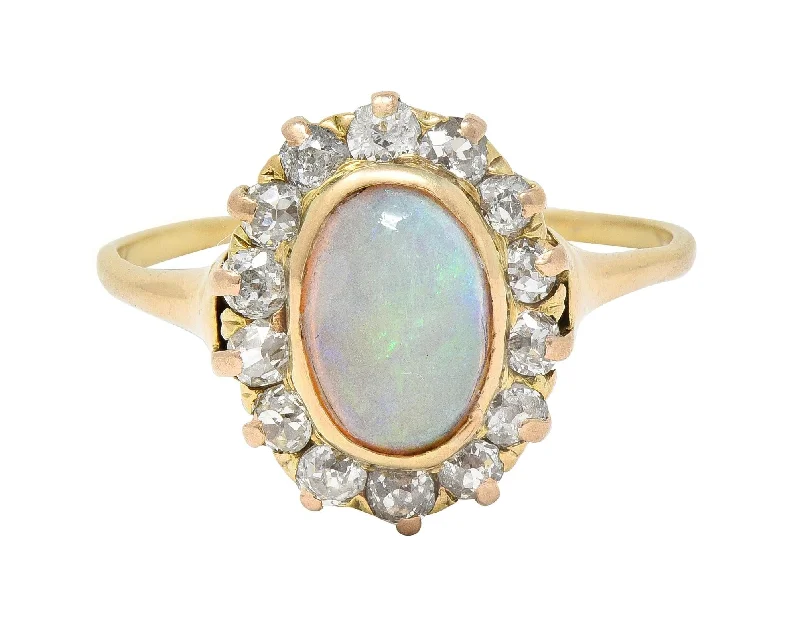 Victorian 0.86 CTW Opal Cabochon Diamond 14 Karat Yellow Gold Antique Halo Ring